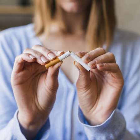 female-hand-breaking-cigarette